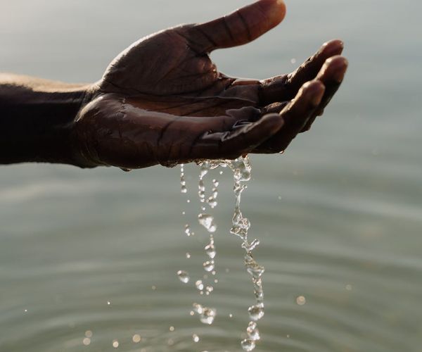 Person stretching gently in a peaceful, minimalist environment.